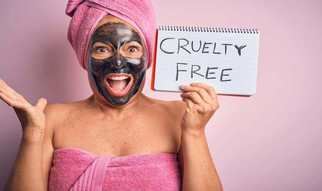 a woman wearing a brunette and holding a cruelty-free note