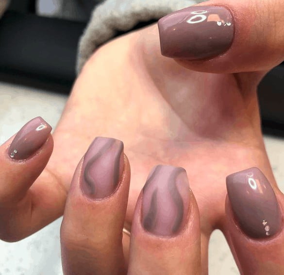nude nails with touch of gray spirals