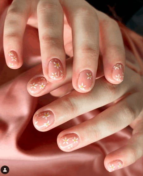 nude pink nail design with yellow flowers