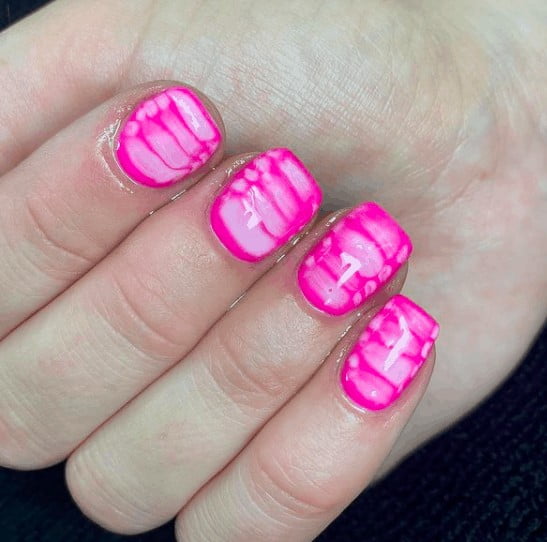pink indie nail design with touch of white lines