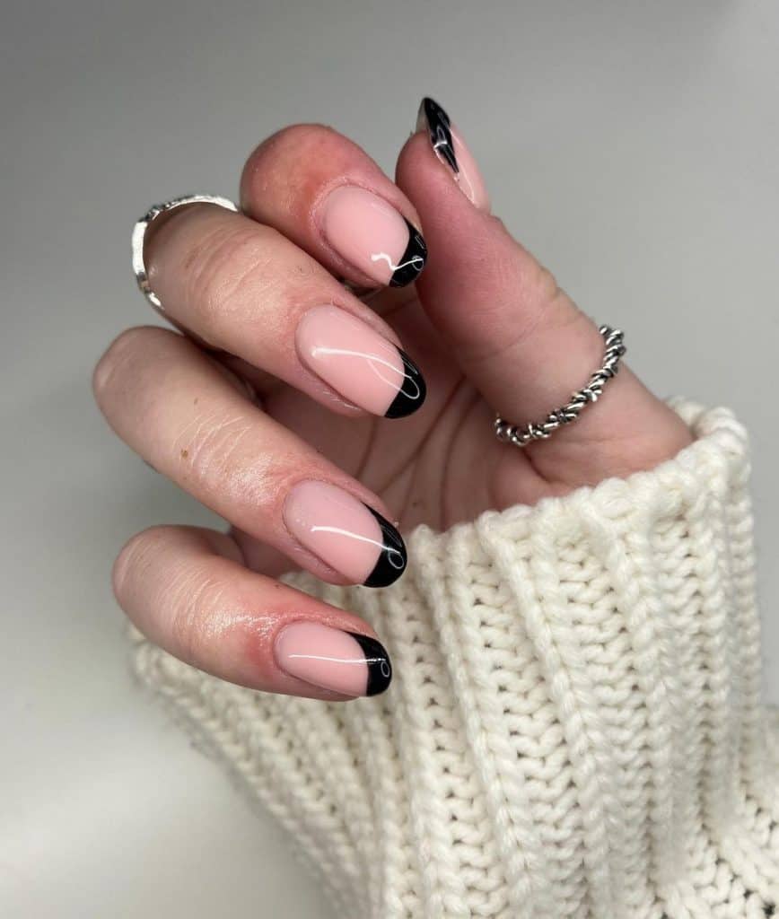nude pink nail design with black tip