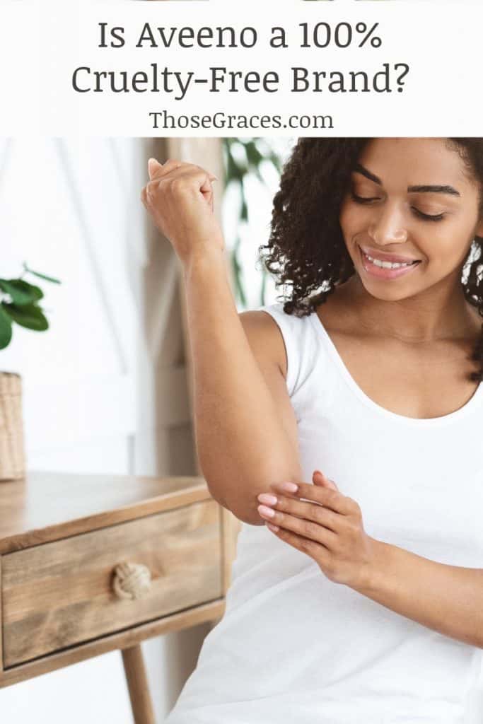 Woman applying lotion to her skin