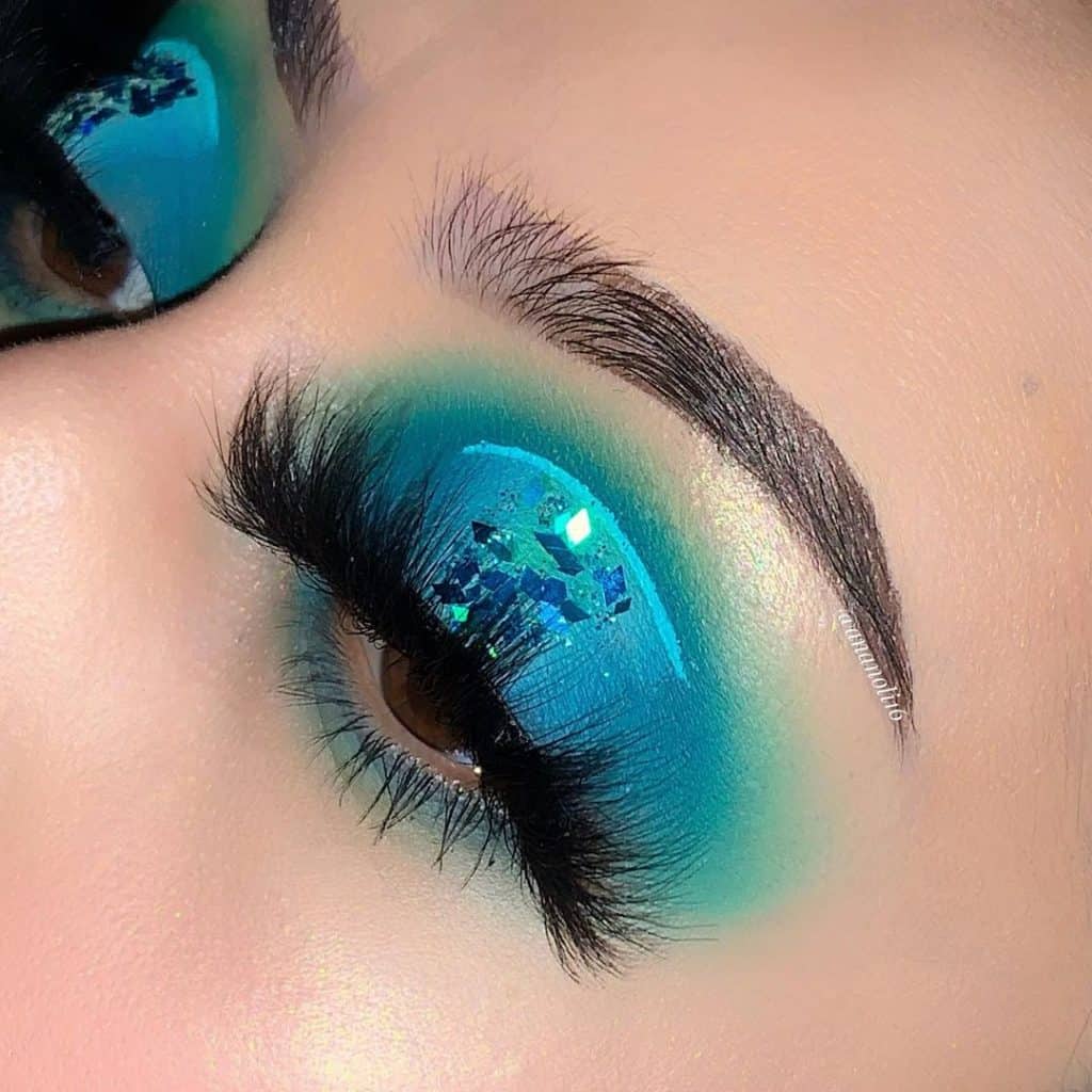 eyes with very bright blue and green eyeshadows for take me back to brazil looks