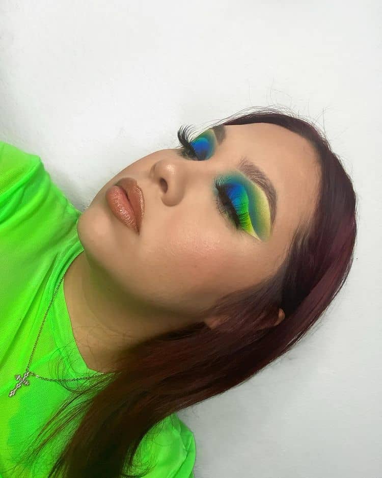 beautiful lady in green with bright green eyeshadows