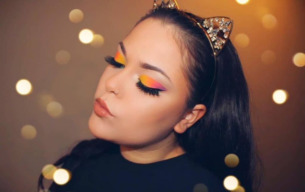 lady with bright eyeshadows with combination of orange and yellow eyeshadows