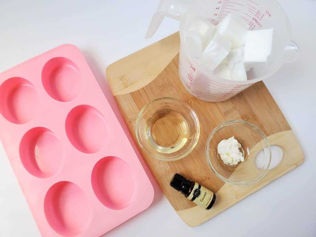 Coconut shampoo bar recipe step one, showing measuring cup and ingredients. 