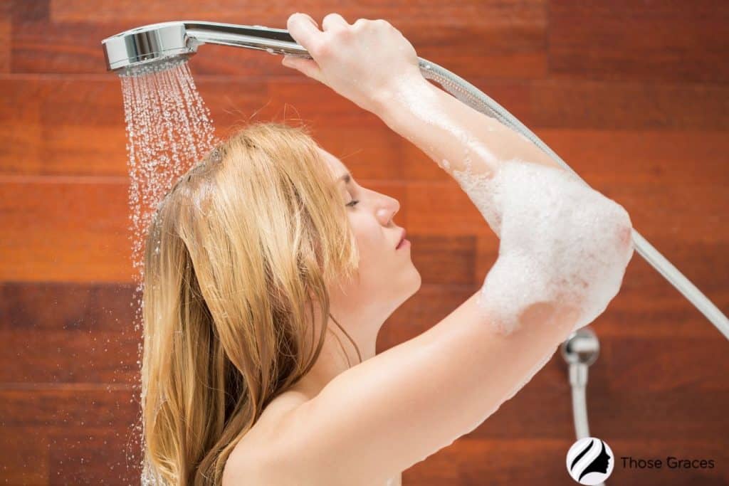 blonde lady taking a shower