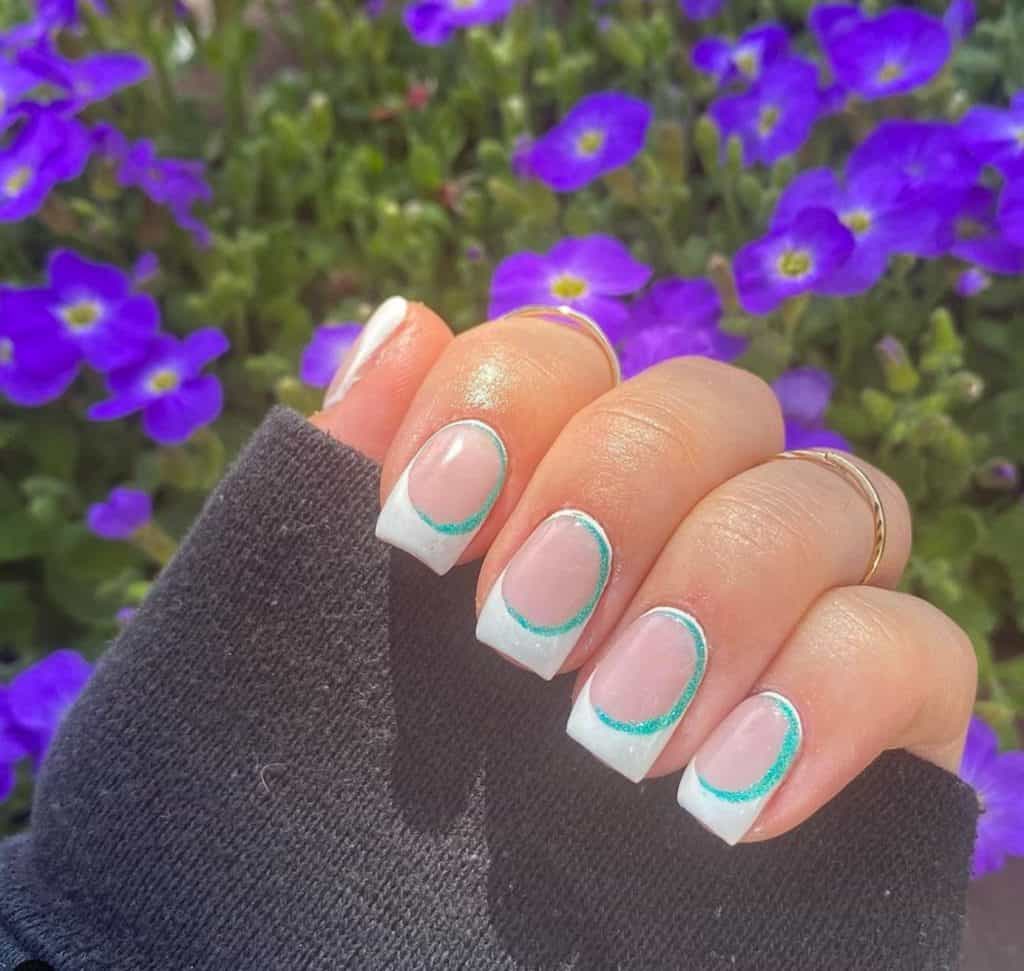 nails with touch of light blue and white tips