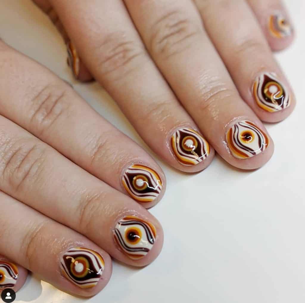 unique nail design with brown and white colors