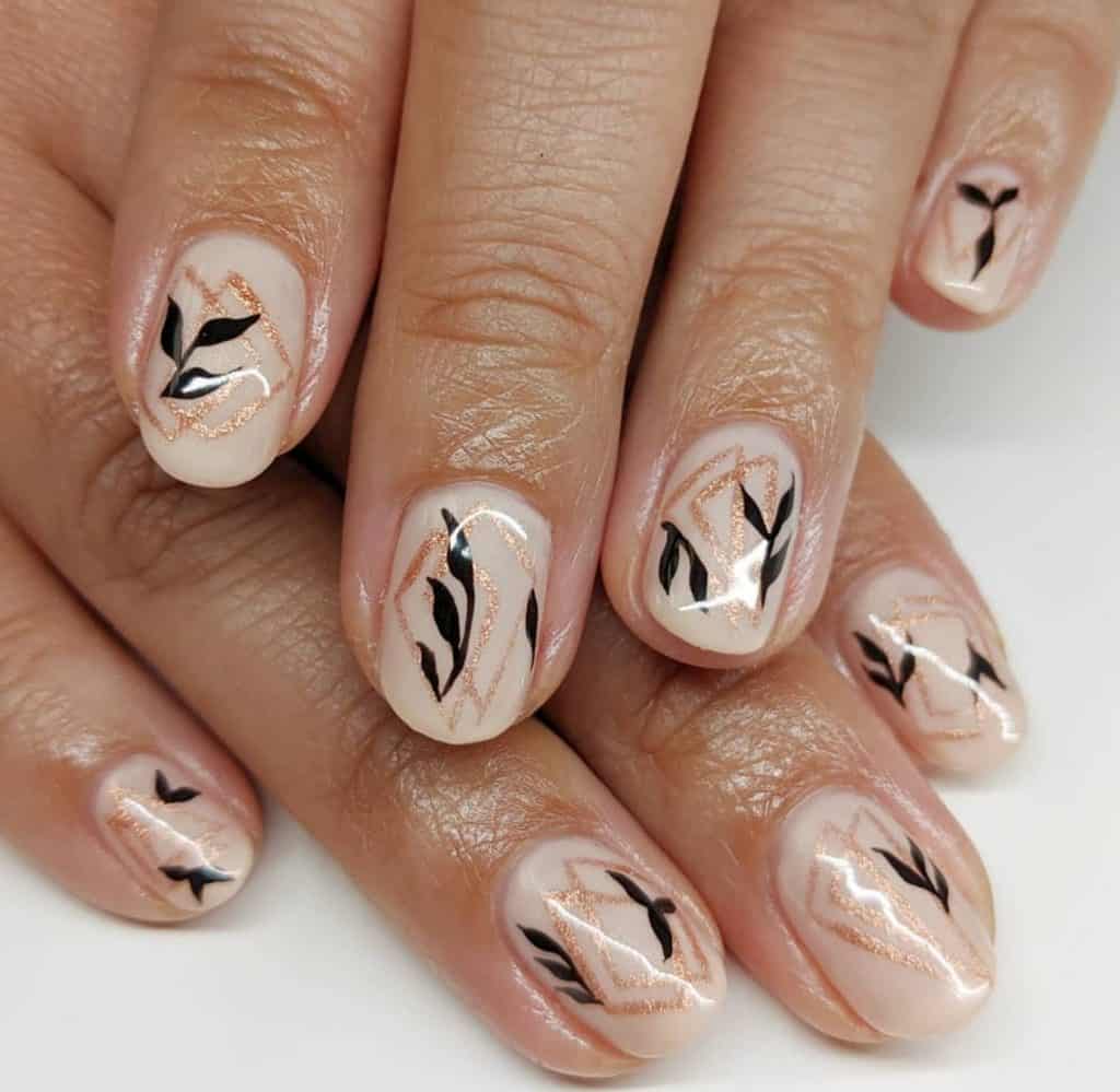 nude nail color with black leaves FALL NAIL DESIGN