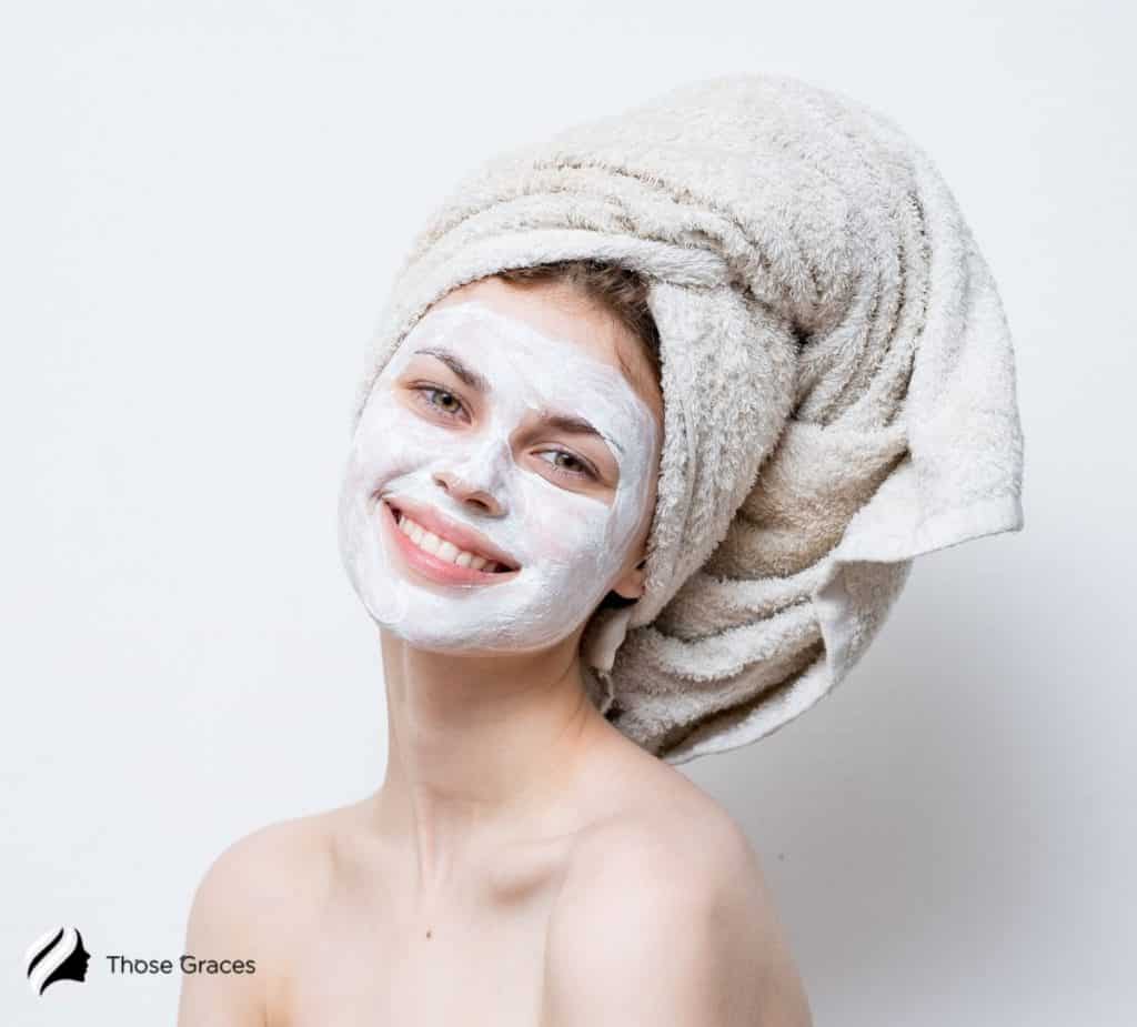 a cute smiling lady with wearing a bentonite face mask