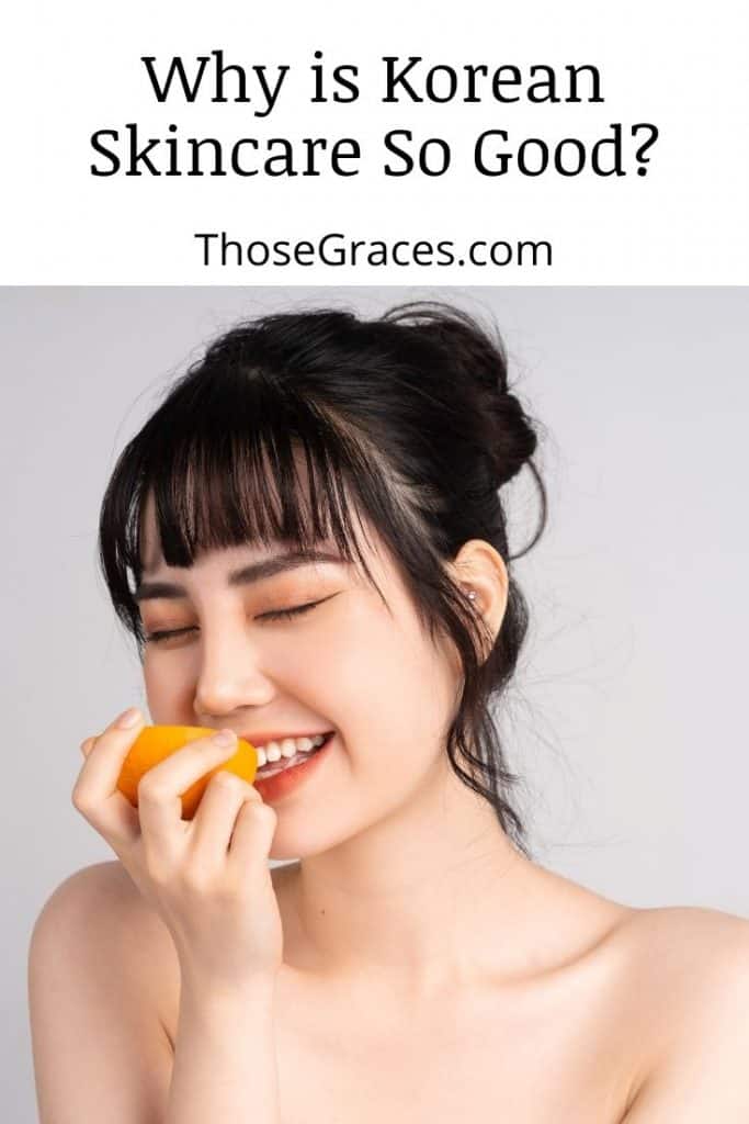 a gorgeous Korean lady eating a fresh orange