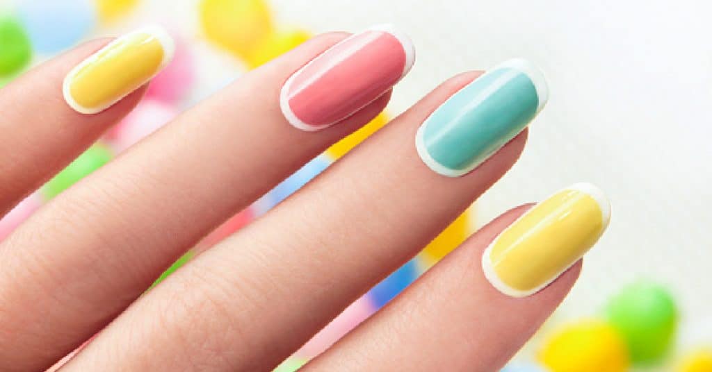Manicure on an oval shaped nails in pastel colored tone