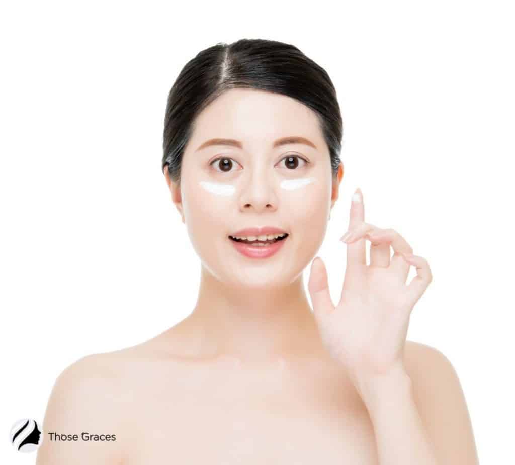 a lady showing what is Korean eye cream and why use it on her face