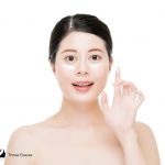 a lady showing what is Korean eye cream and why use it on her face