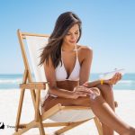 lady in white bikini using tingle tanning lotion