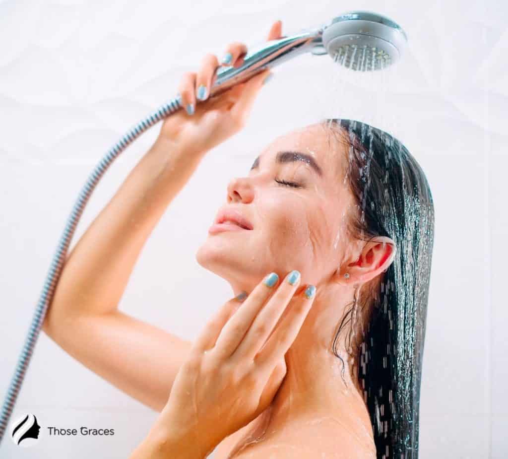 a pretty lady taking shower before tanning