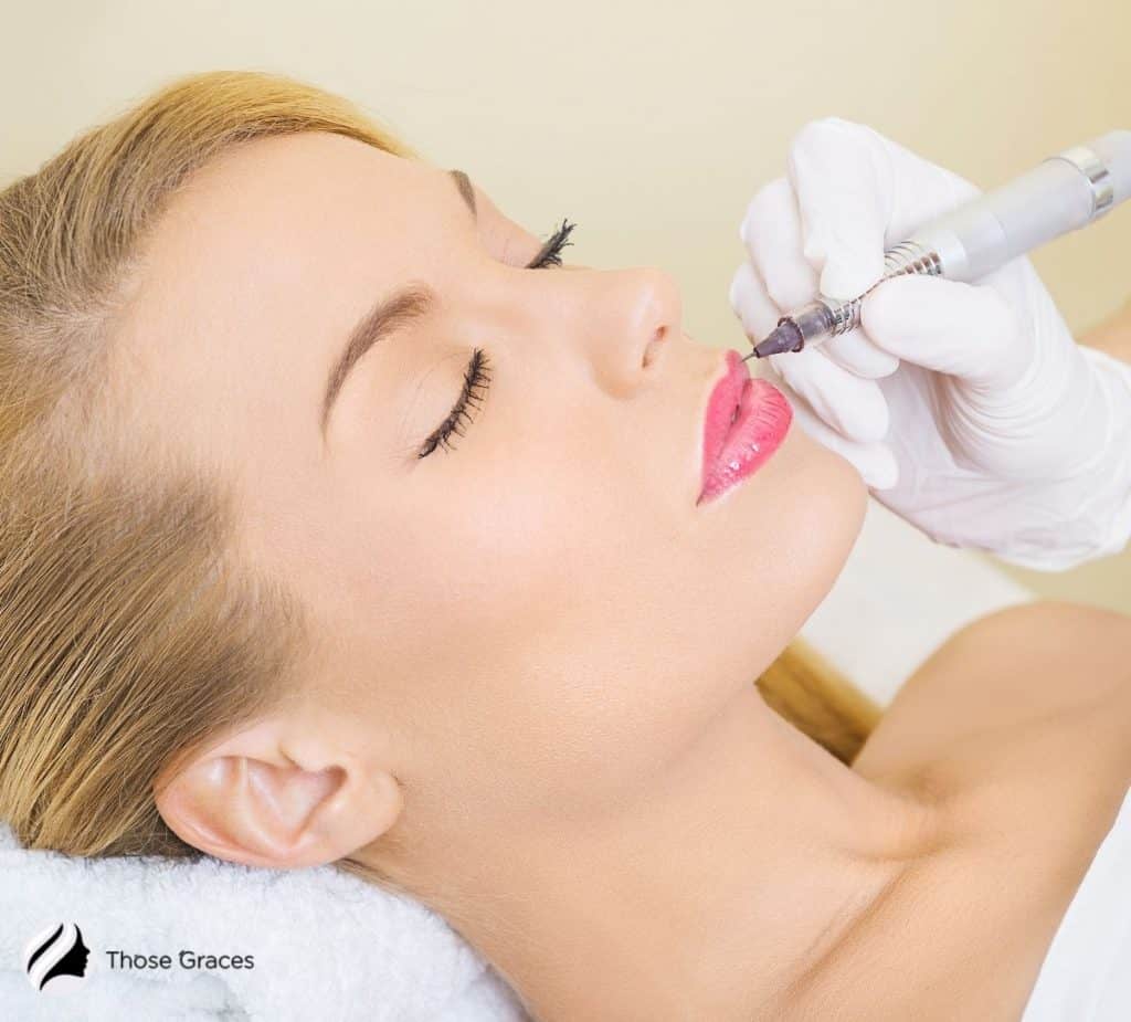 pretty woman having a permanent lip tattoo session: how long does permanent makeup last?