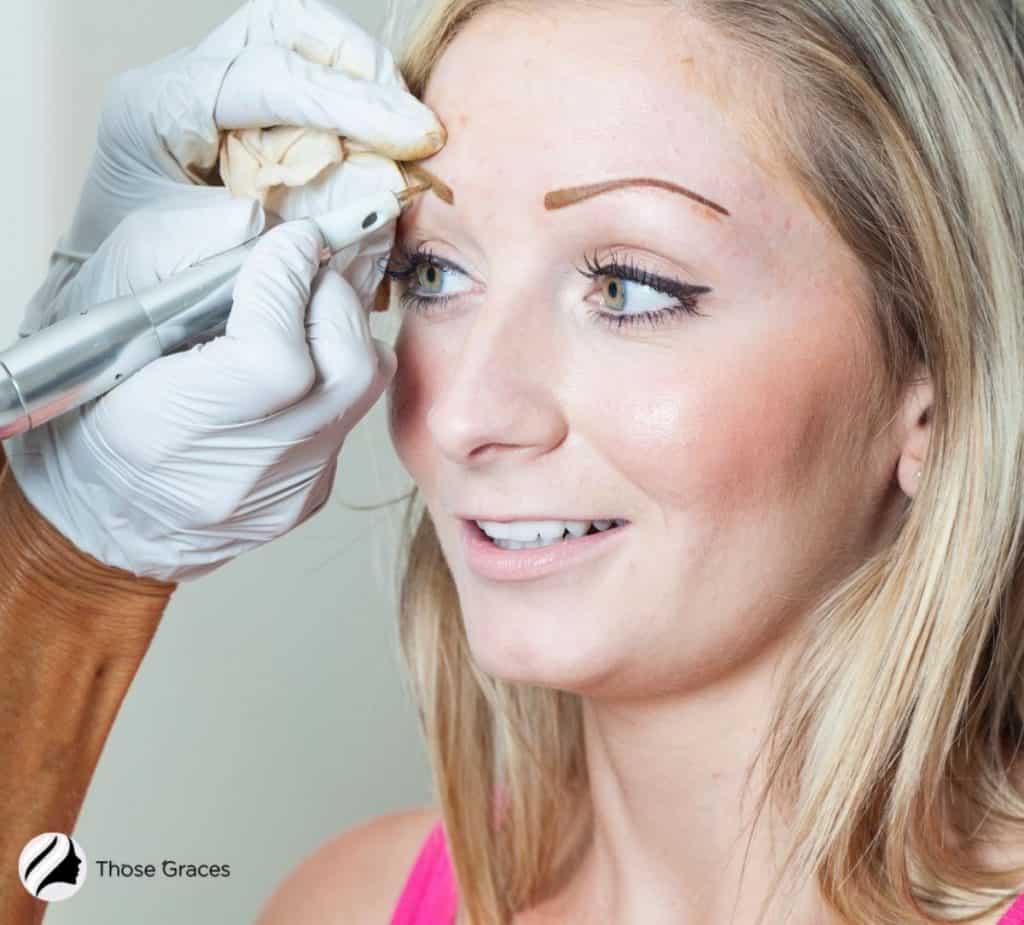 lady getting permanent brown tatooo eyebrows