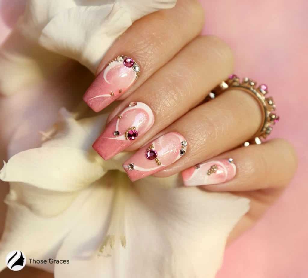 hand with pink press on nails