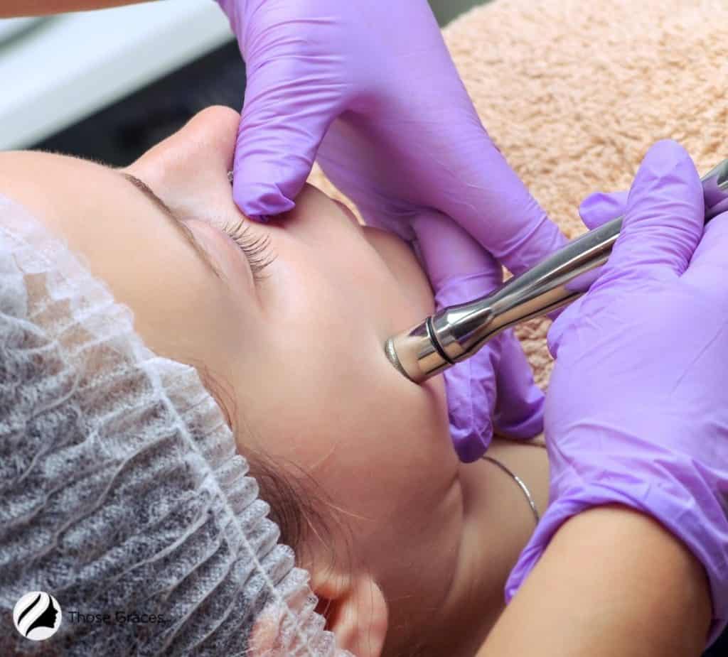 An esthetician using diamondtome microdermabrasion device