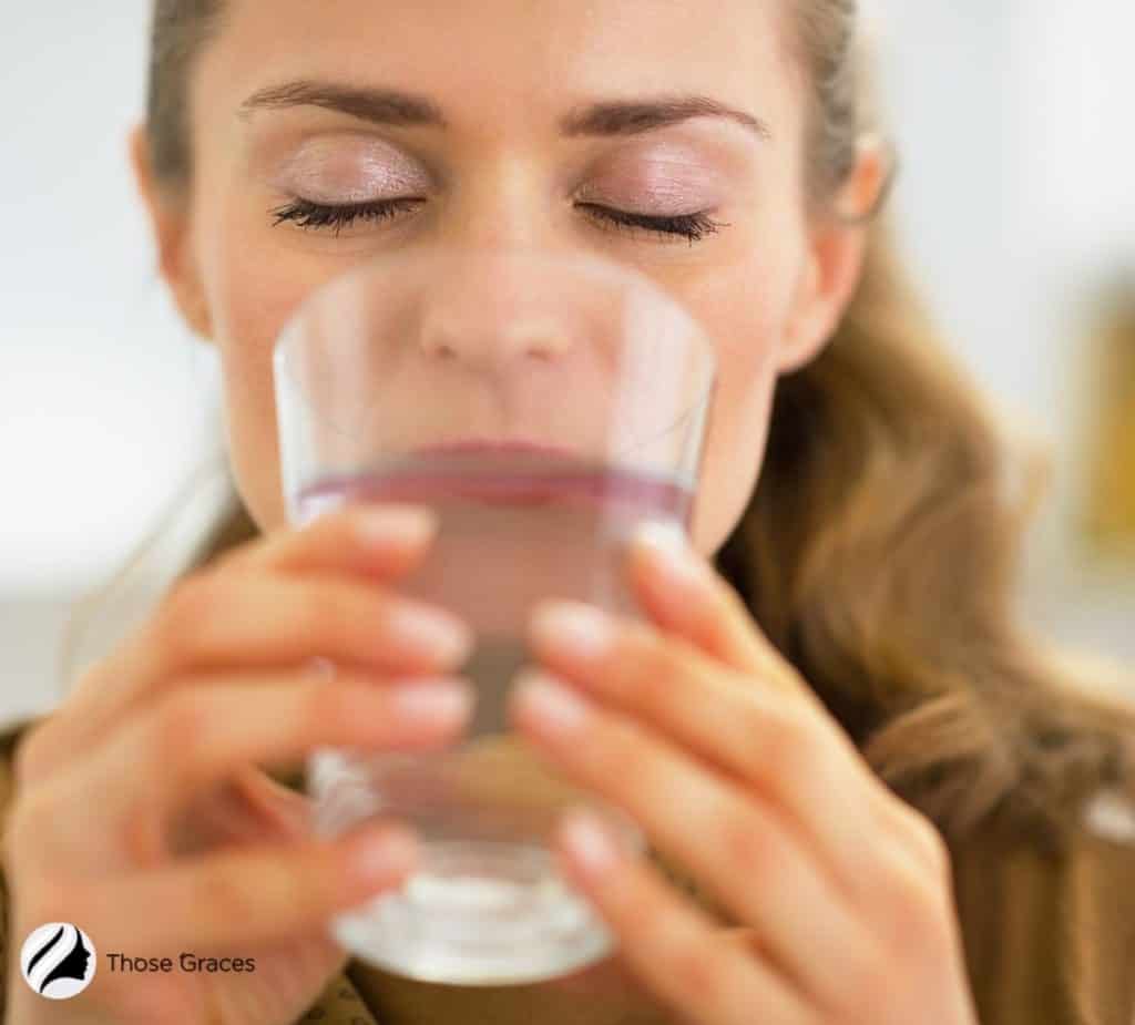 Lady with porcelain skin staying hydrated