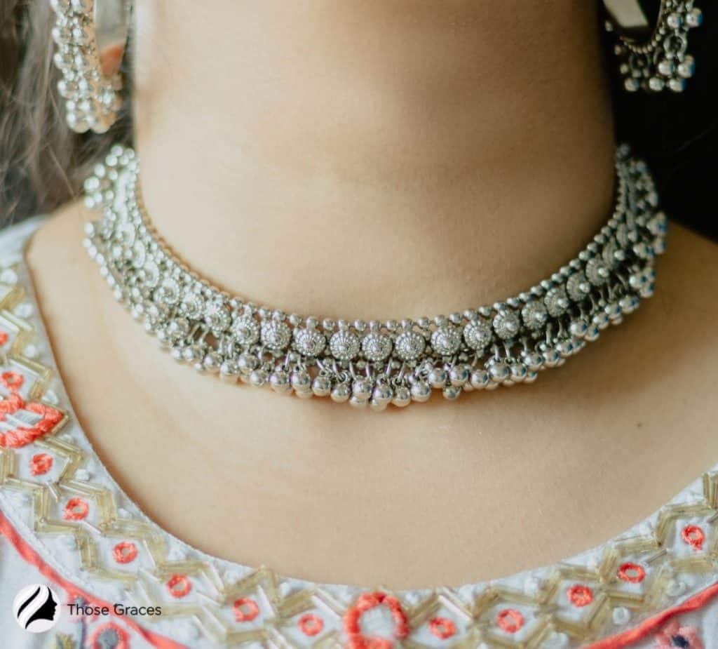 Lady in beautiful silver jewellery with porcelain skin tone