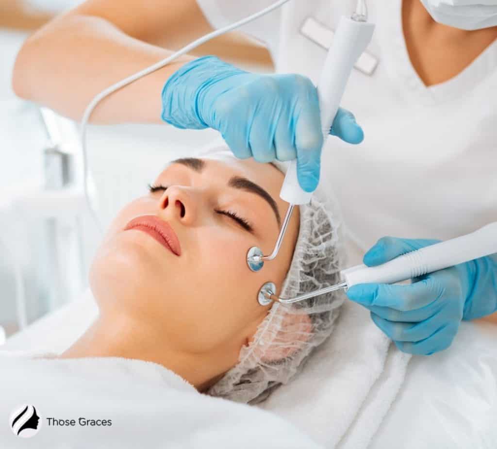 professional performing facial microcurrent to the woman