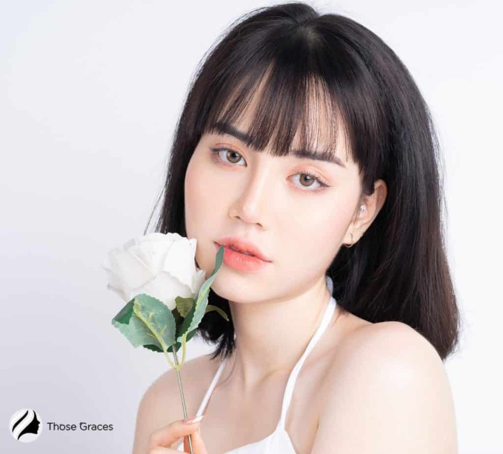 A Korean beauty with a rose in her mouth