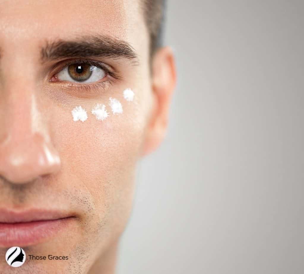 man applying eye cream under title Korean Skin Care Routine For Men