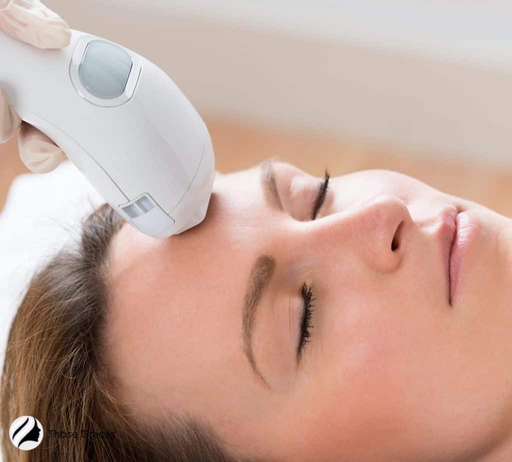 lady sleeping getting a facial under title Microderm Glo vs Mini