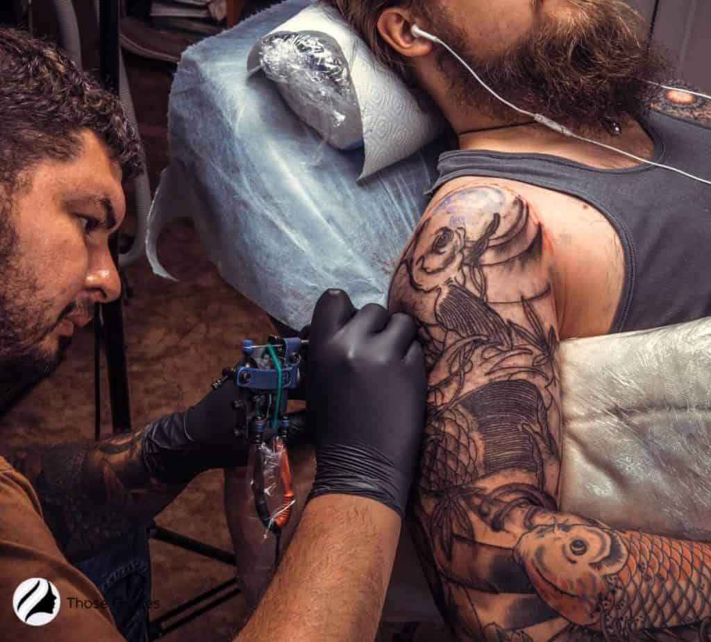 man getting a tattoo