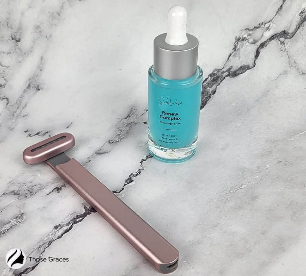 solawave facial wand and renew complex serum on the table