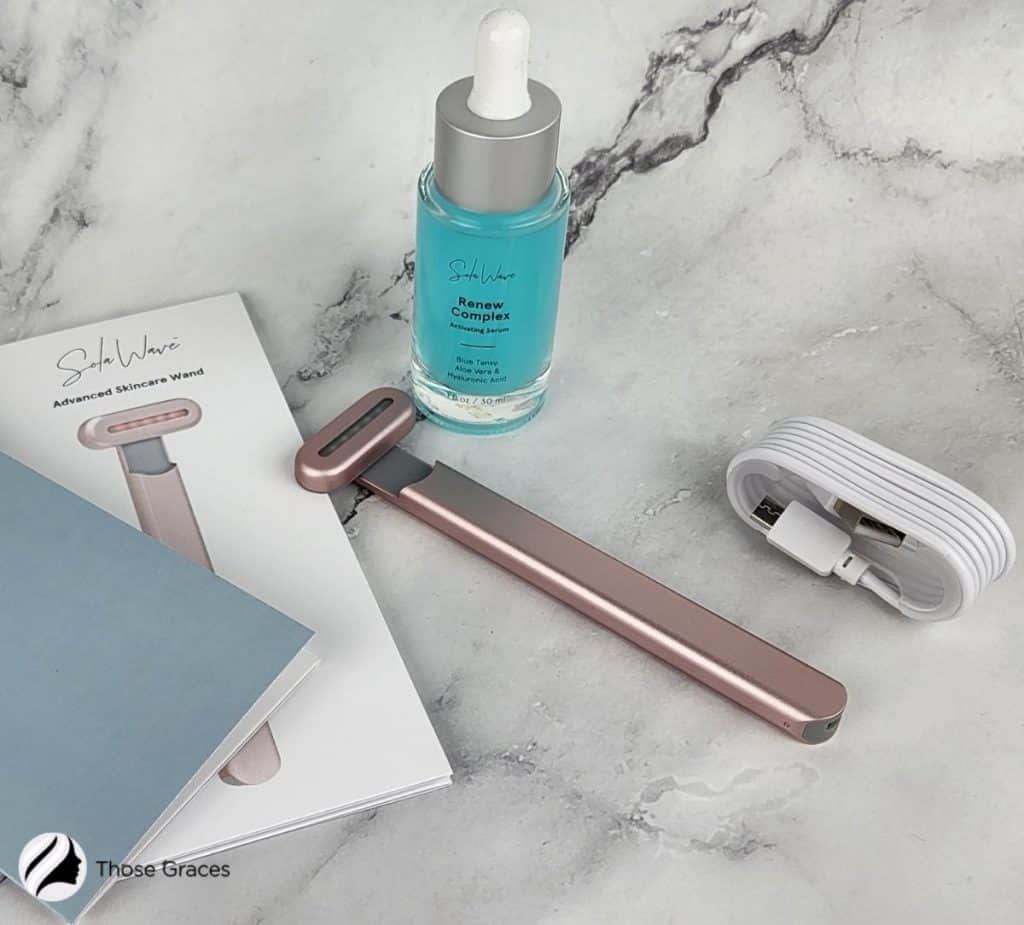 solawave facial wand, renew complex serum, usb charger and book guide