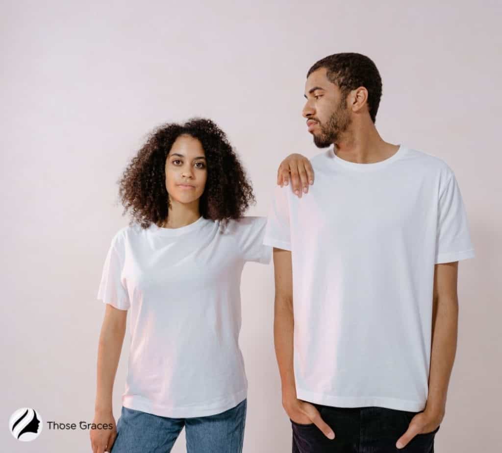 couple with an olive skin wearing creamy white shirts