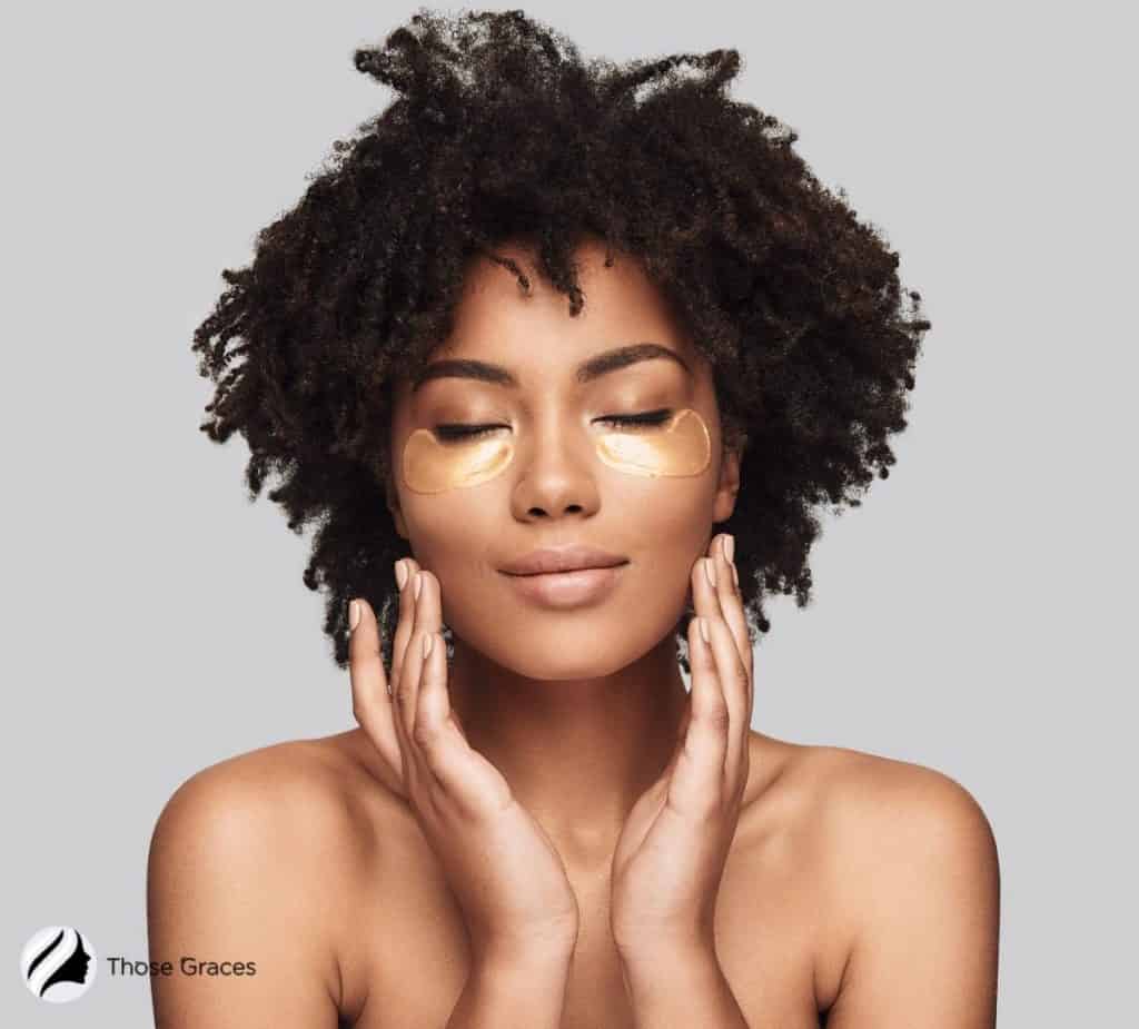 African American model with eye cream on