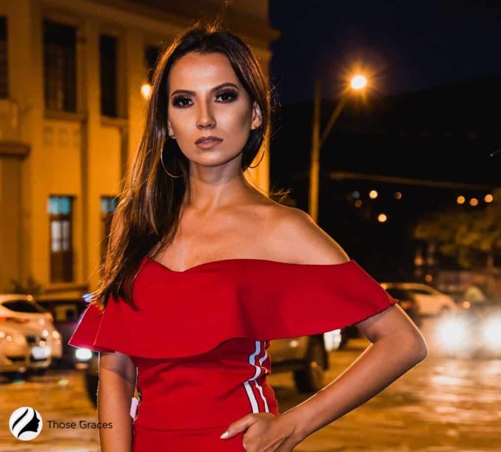 woman with an olive skin wearing a red colored dress