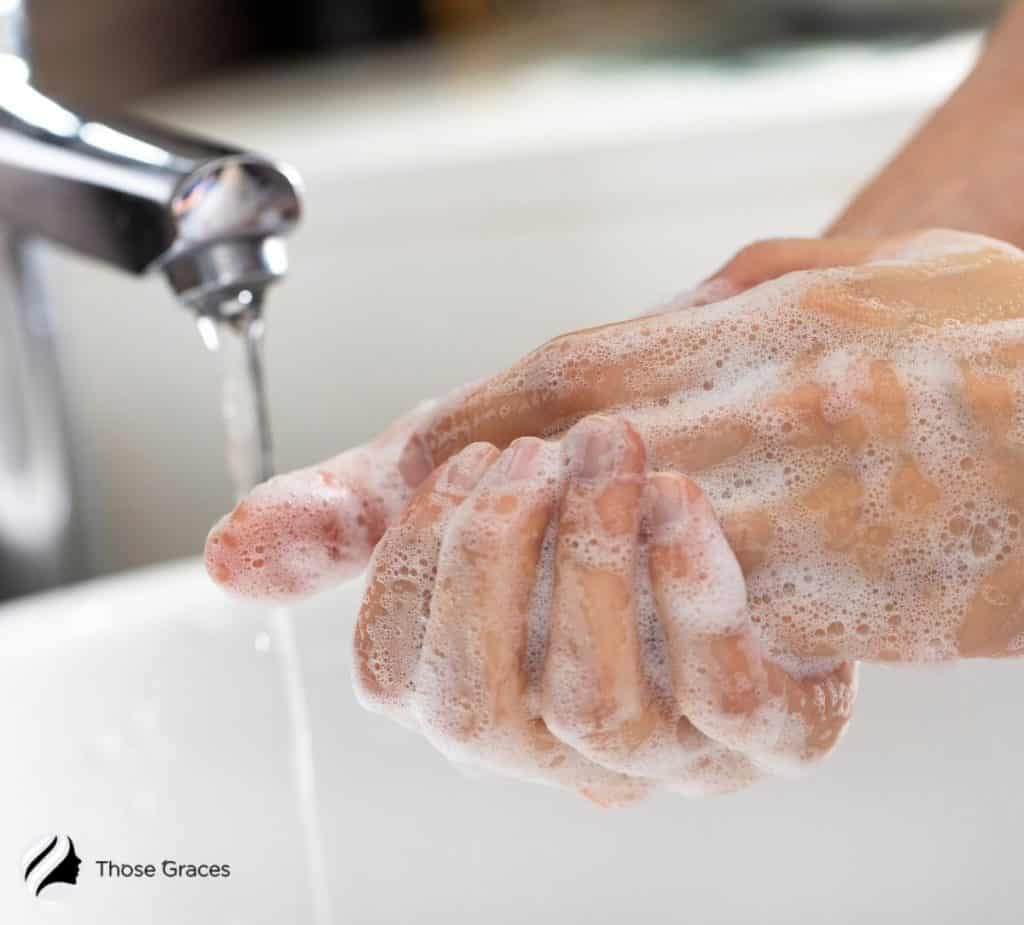 a person washing her hand
