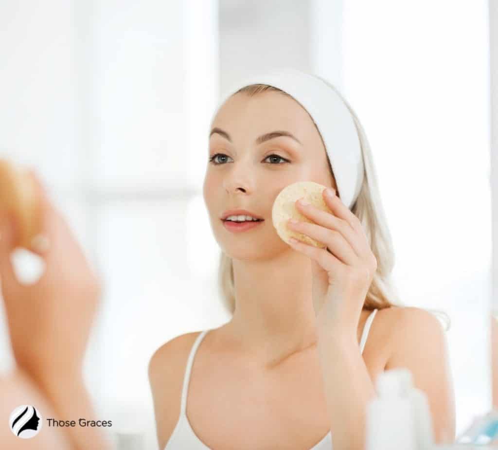 a woman exfoliating herself