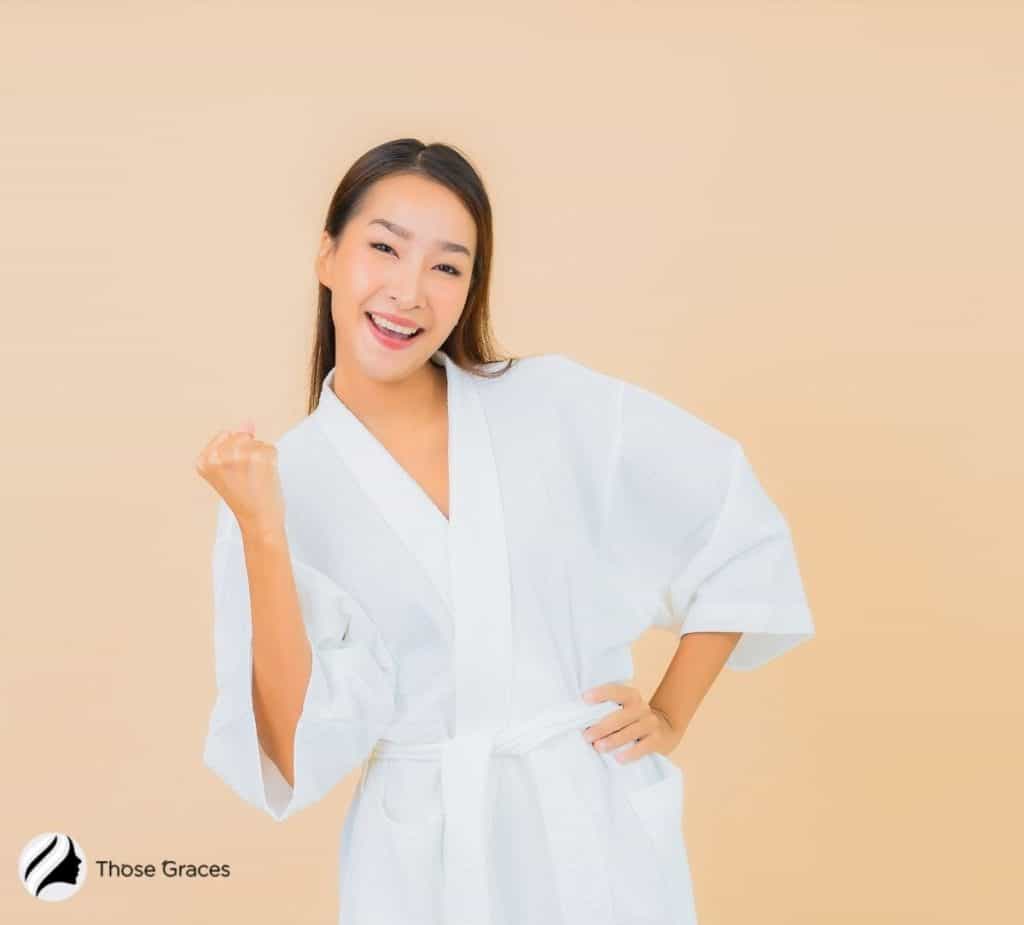 a woman with a clear skin in a bathrobe