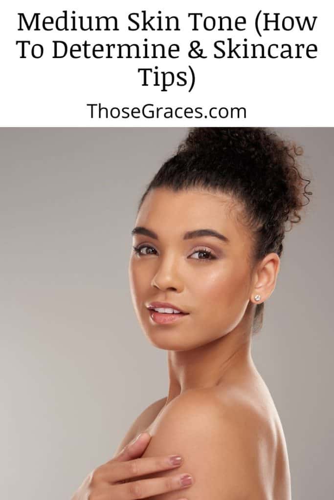 a model in a bun with medium skin tone