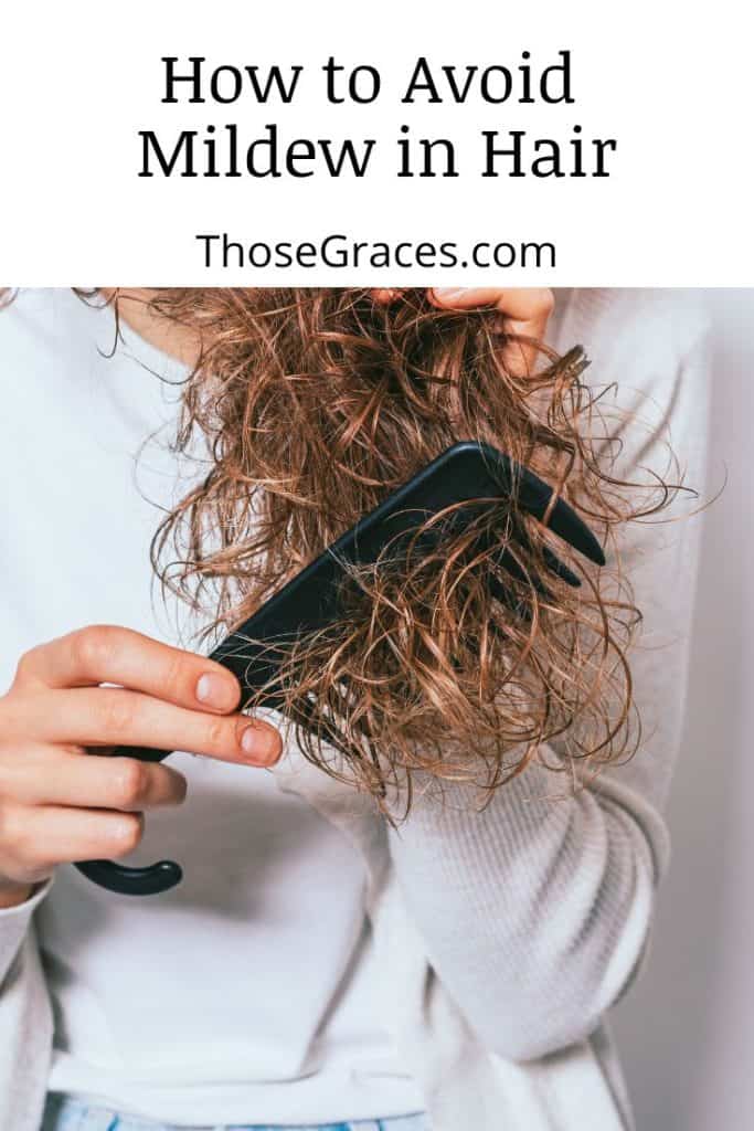 lady brushing her tangled curly hair