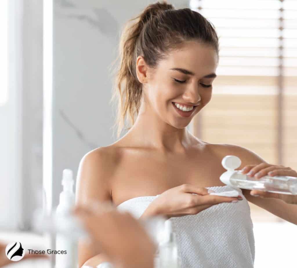 lady putting micellar water on a cotton pad