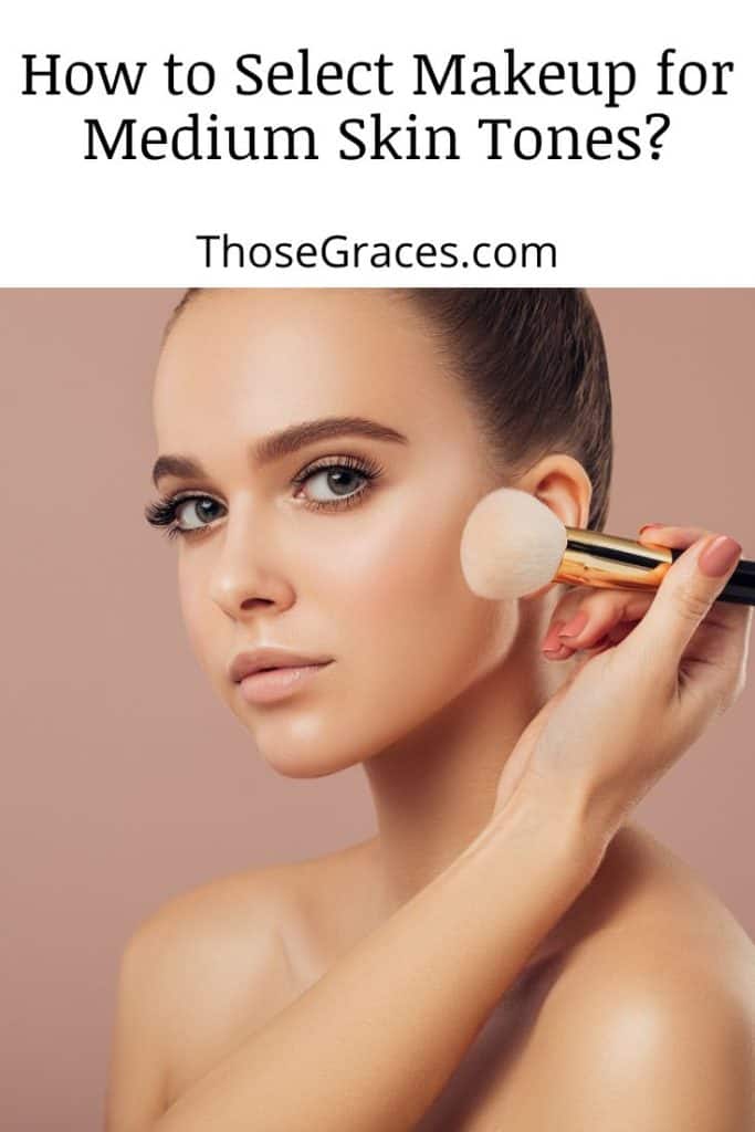 lady putting on a light pink blush for her medium skin