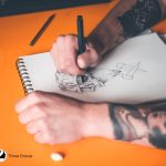 beginner artist practicing one of the best drawing exercises for tattoo artists