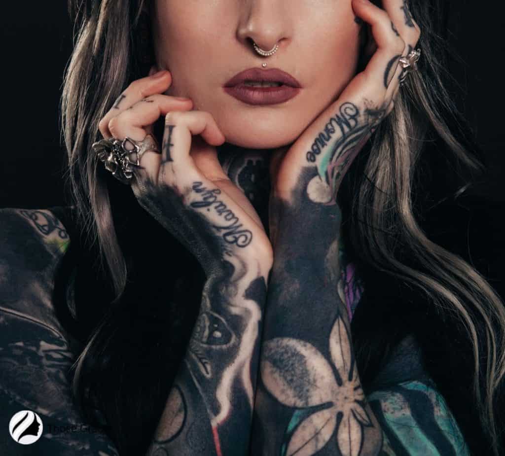 women with tattoo on hand