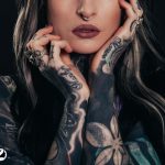 women with tattoo on hand