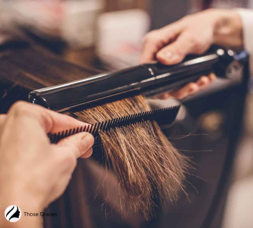 straightening the hair using a heat tool