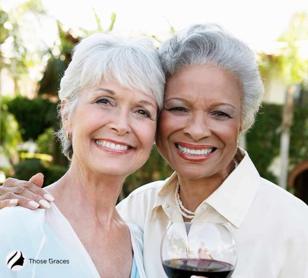 senior women drinking wine together