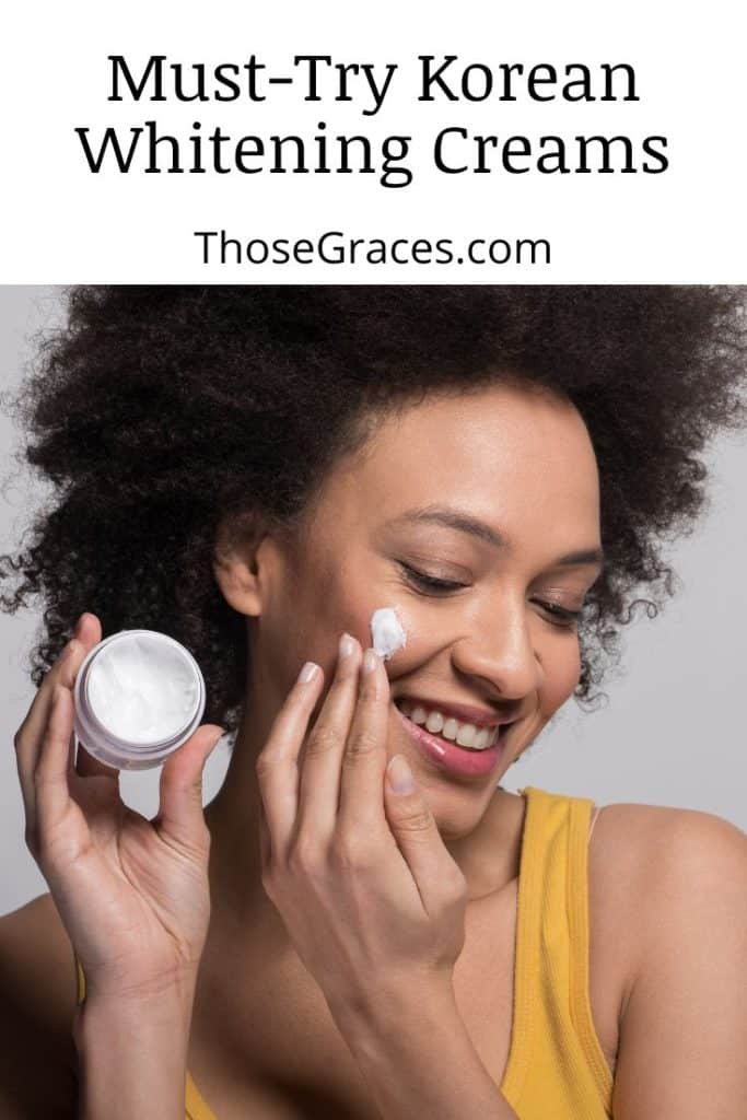 curly-haired woman putting on some whitening cream